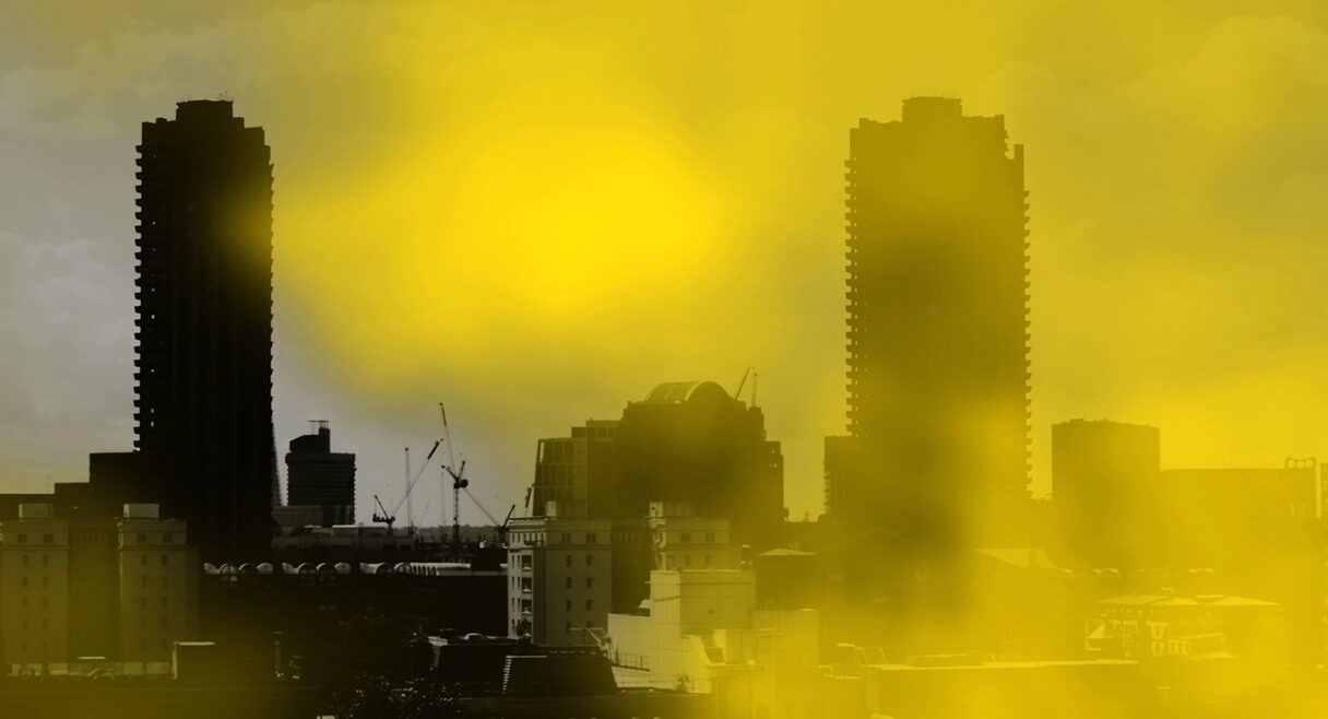 image of a city scape with yellow toxic dust surrounding it