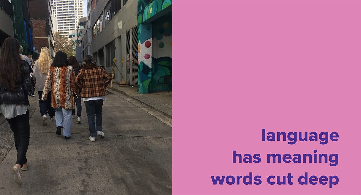 Pink box with text that says language has meaning words cut deep and people walking in a back alley